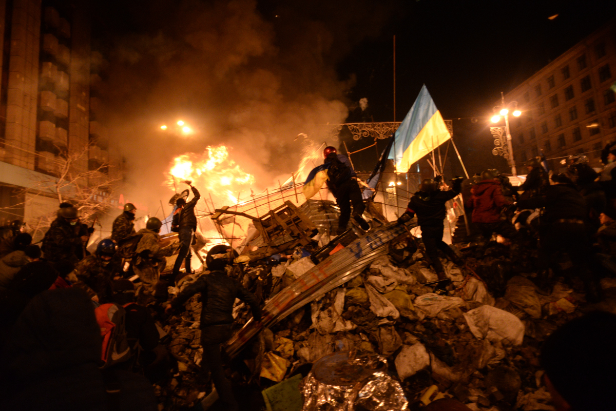 SState flag of Ukraine carried by a protester to the heart of developing clashes in Kyiv Ukraine. Events of February 18 2014 Mstyslav Chernov